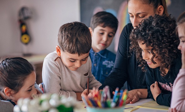 Group of children learning writing in preschool